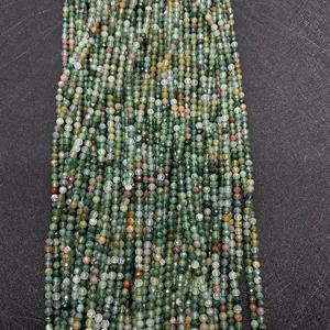 Detailed view of faceted Indian Agate beads in natural green and brown tones