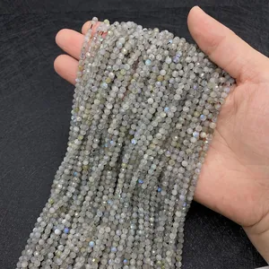 Macro detail of faceted natural labradorite beads showing blue and yellow flashes