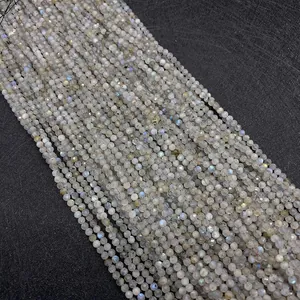Macro view of 2-3mm faceted labradorite round beads with blue labradorescence