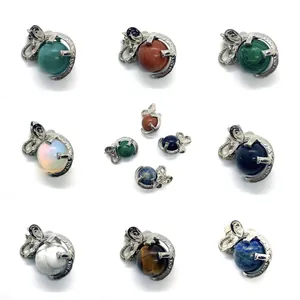 Detailed grid of elephant-shaped natural stone pendants with polished metal textures