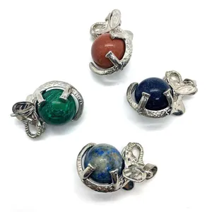 Set of four elephant-shaped natural stone pendants in gold sandstone and opal