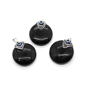 Flat round black agate stone pendants with evil eye crystals and silver bails