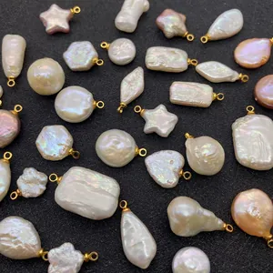 Macro view of baroque freshwater pearl pendants in heart and star shapes for DIY jewelry