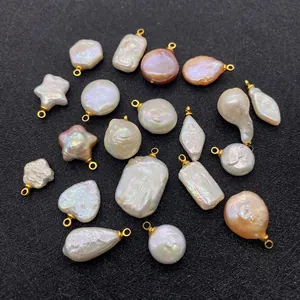 Detailed flat lay of assorted Baroque freshwater pearl charms in various shapes for jewelry DIY