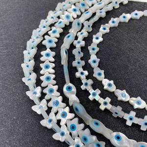 Natural mother of pearl shell beads with evil eye pattern in butterfly and cross shapes