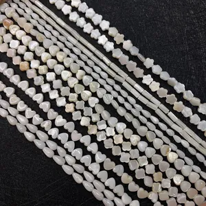 Natural white shell beads in heart, flower, and teardrop shapes for jewelry making
