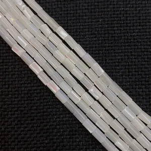 Five strands of white cylindrical mother of pearl shell beads with iridescent luster