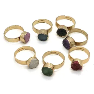 Detailed view of assorted 10mm natural stone crystal druzy rings with gold adjustable bands