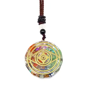 Detailed view of handmade orgonite pendant with healing stones and sacred geometry