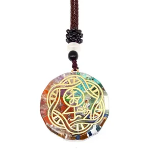Macro view of Orgone pendant with colorful natural stones and gold metal filigree