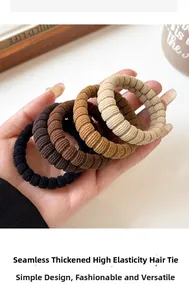 Detailed close-up of thick seamless high-elastic hair ties in four neutral earth tones