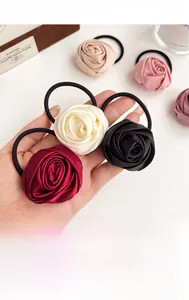 Macro shot of high-quality satin rose hair ties in various elegant vintage colors