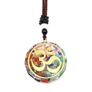 Macro detail of Seven Chakra resin pendant with Om symbol and colorful healing stones