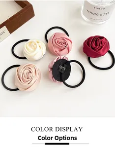 Detailed close-up of handmade satin rose hair ties in various colors with elastic bands
