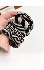 Close-up of seamless checkered hair ties showing thick elastic knit texture and patterns