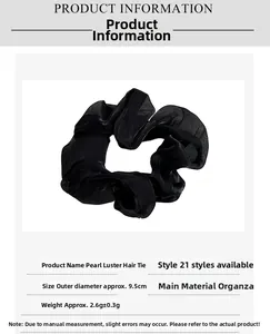 Détail du chouchou en organza noir avec diamètre de 9,5 cm et poids léger de 2,6 g