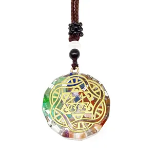 Orgonite energy necklace with colorful natural stones and gold geometric pattern
