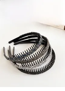 Detail of four non-slip rhinestone headbands with teeth in blue, grey, white and black