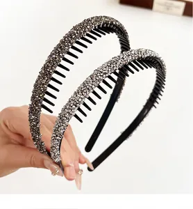 Detailed view of silver and charcoal non-slip headbands with dense rhinestones and inner teeth