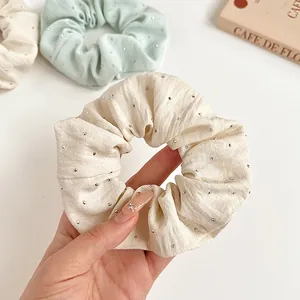 Sparkly rhinestone scrunchies for hair in cream white and light green fabric