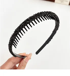 Detail of black non-slip headband with sparkling crystals and inner teeth for secure grip