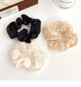 Lot de 3 chouchous en organza irisé noir, champagne et blanc aux textures plissées fines