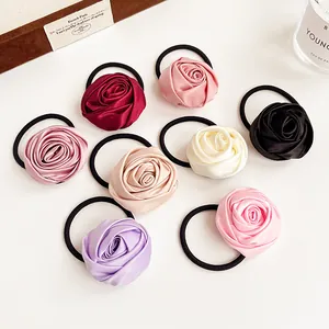 Set of 8 French satin rose hair scrunchies in assorted colors on a white background