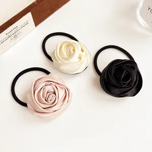 Three-piece satin rose flower hair scrunchies in cream, pink, and black colors