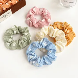 5-piece floral pattern scrunchie set in assorted soft colors for girls hair styling