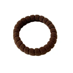 Elastic coffee brown ribbed hair tie with durable stretch for women hairstyles
