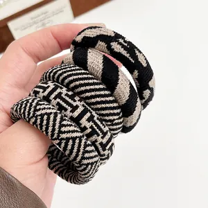 Set of four thick checkered and houndstooth elastic hair ties in neutral beige and black