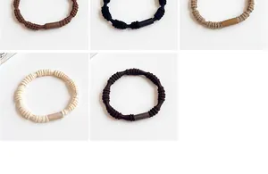 Close-up of high-elastic braided hair ties in various neutral earth tones and textures