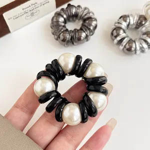 Elegant spiral phone cord hair tie with pearl accents and high elasticity for ponytails