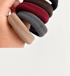 Detailed texture of thick high-elasticity hair ties in assorted neutral colors