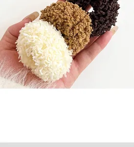 Detail showing plush thick faux fur scrunchies in cream, khaki, and dark brown colors