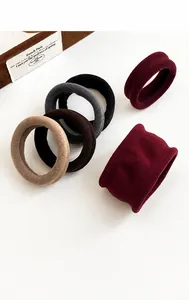 Detailed view of seamless high-elastic hair ties in various earthy tones and 4cm width