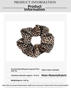 Macro detail of leopard print hair scrunchie showing 10.5cm diameter and soft fabric texture