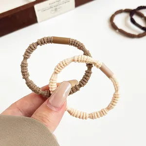 Brown and beige spiral texture hair ties in high-elasticity fabric for daily styling