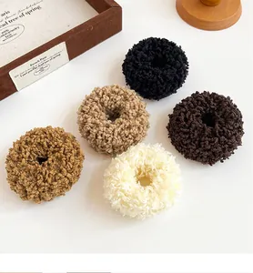 Detailed macro view of five thick plush hair ties in earthy tones for autumn winter
