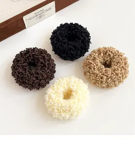 Set of four plush faux fur scrunchies in black, brown, beige and cream white colors