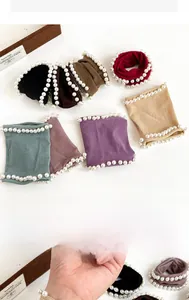 Close-up of high-elasticity hair ties with inlaid pearls in various stylish colors