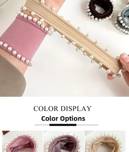 Detail of high-elastic pearl hair ties in pink, beige, dark brown and grey-green