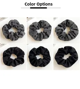 Detailed grid view of six black and grey polka dot scrunchies with various patterns