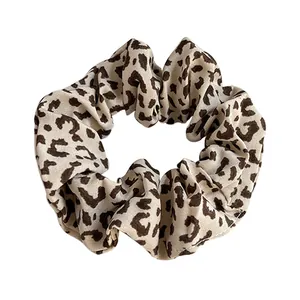 Classic leopard print scrunchie made of soft fabric for stylish high elasticity hairstyles