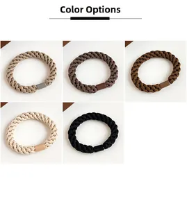 Close-up of thick braided high-elasticity hair ties in five neutral earth-tone colors
