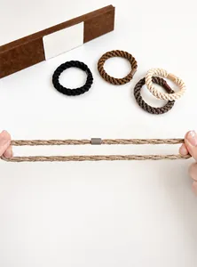 Detail showing elastic braided hair ties in earth tones with high stretch capability