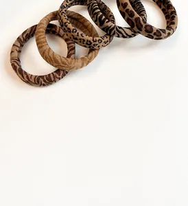 Detailed view of 5-piece leopard and zebra print elastic hair scrunchies set