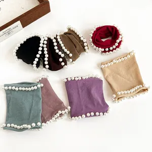 Elastic pearl hair ties in various colors including black, brown, and pastel tones