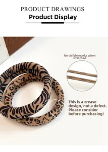 Detail view of leopard print hair scrunchies showing seamless high-elasticity design