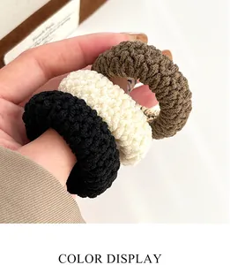 Detailed knit texture of high-elasticity hair ties in coffee, cream, and black colors